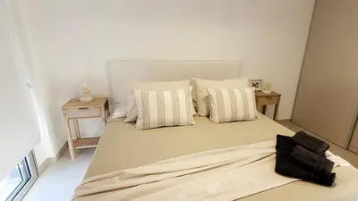 a bedroom with a large bed with pillows at Departamento en Carlos Paz con vistas y céntrico in Villa Carlos Paz