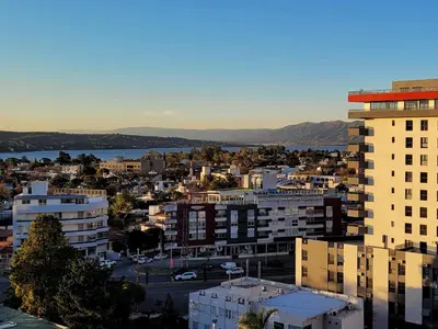 an aerial view of a city with a building at Departamento en Carlos Paz con vistas y céntrico in Villa Carlos Paz
