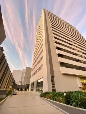 a tall white building with a sky in the background at Dpto Premium en Torre Cofico con cochera incluida - Pileta en Terraza in Cordoba
