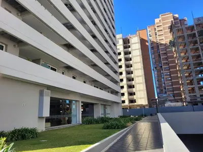 an external view of a building with tall buildings at Dpto Premium en Torre Cofico con cochera incluida - Pileta en Terraza in Cordoba