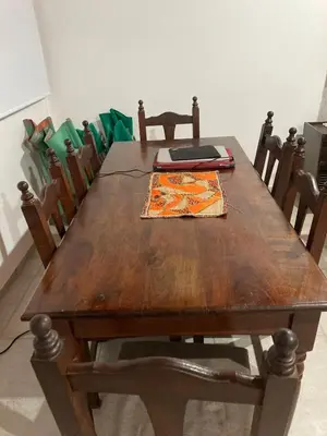 a wooden table with a laptop on top of it at Soligna-alquiler in Villa Santa Cruz del Lago