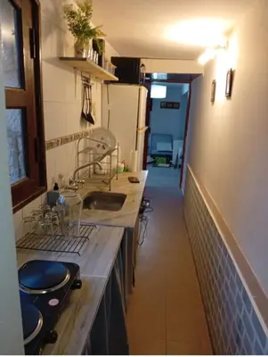 a kitchen with a sink and a counter top at Balcón al Tajamar in Alta Gracia