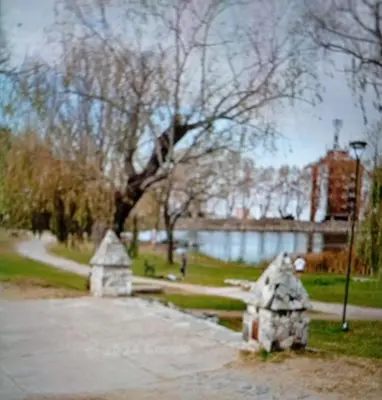 a park with a fire hydrant in the grass at Balcón al Tajamar in Alta Gracia
