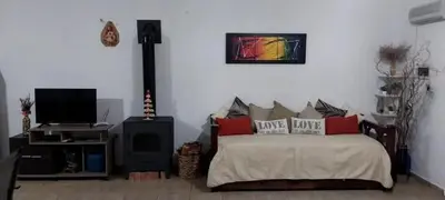 a bedroom with a bed and a tv in a room at Casa en las sierras de córdoba in Tanti