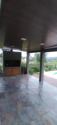 a large living room with a large screen tv at Casa en las sierras de córdoba in Tanti