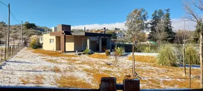 a house in the middle of a field at Casa en las sierras de córdoba in Tanti