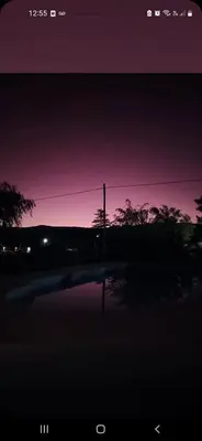 a night view of a street with a purple sky at Casa en las sierras de córdoba in Tanti