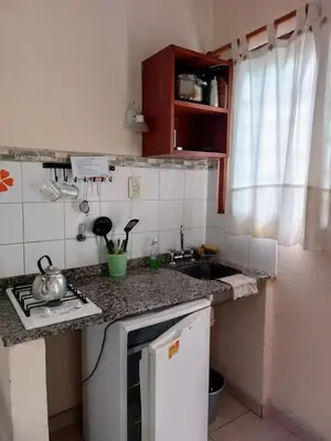 a kitchen with a sink and a counter top at APART HOTEl ACUARELA in Mina Clavero