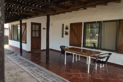 a table and chairs on the porch of a house at Colores de Panaholma in Panaholma