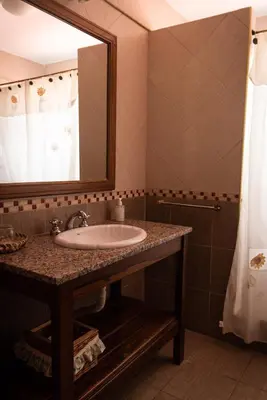 a bathroom with a sink and a mirror at Colores de Panaholma in Panaholma