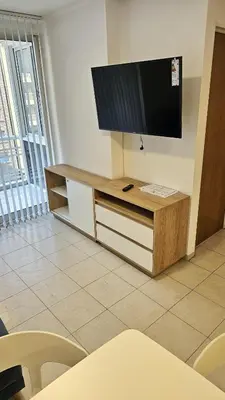a living room with a flat screen tv on the wall at Paraná 640 in Cordoba