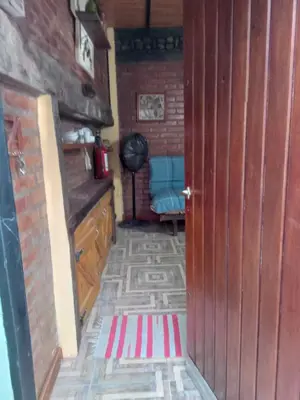 a room with a door and a rug on the floor at Lo de iaia in Carpintería