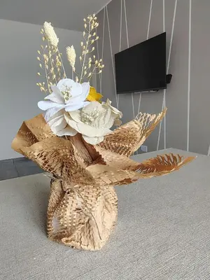 a vase filled with flowers on top of a table at DeptoViamonte 2 Luminoso a estrenar con cochera in Cordoba