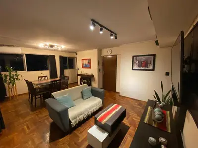 a living room with a couch and a table at Departamento Amoblado in Cordoba