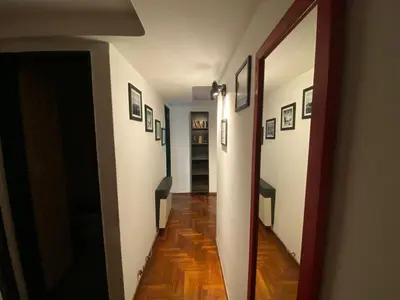 a hallway with pictures on the walls of a house at Departamento Amoblado in Cordoba