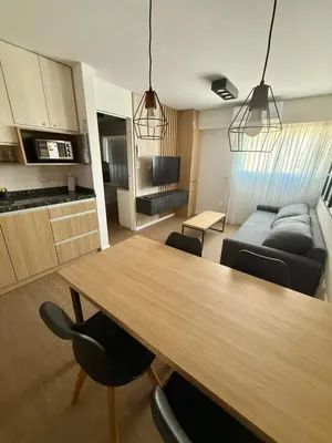 a living room with a table and a couch at Departamento Elegante y Funcional SS10 in Cordoba