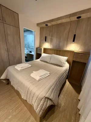 a bedroom with a bed with two towels on it at Departamento Elegante y Funcional SS10 in Cordoba