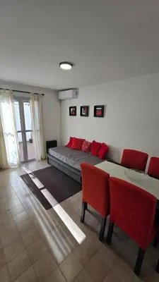 a bedroom with a bed and a table and chairs at Dpto zona NUEVO CENTRO shopping y PATIO OLMOS in Cordoba