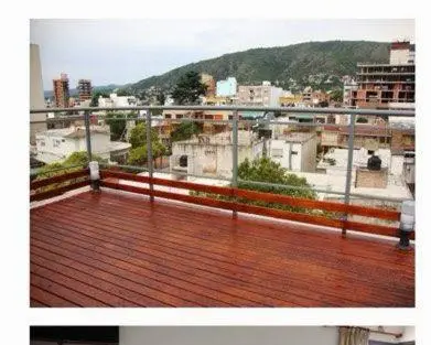 a balcony with a view of a city at Dulces Sueños in Villa Carlos Paz