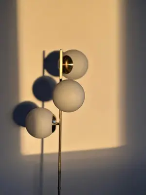 a metal object with four circles on a wall at Dpto con vista a las sierras in Cordoba