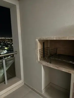 a room with a balcony with a bed and a window at Dpto con vista a las sierras in Cordoba