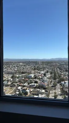 a view of a city from a window at Dpto con vista a las sierras in Cordoba