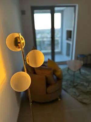 a living room with a couch and a chair at Dpto con vista a las sierras in Cordoba