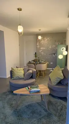 a living room with two couches and a table at Dpto con vista a las sierras in Cordoba