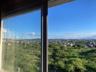 a view of a city from a window at Departamento ideal Pileta, Parrilla y Pet friendly in Cavalango