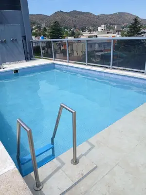 a large swimming pool on top of a building at NGdeptosVCP in Villa Carlos Paz