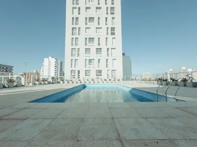 a pool in the middle of a city with buildings at MR HOST 20 | Departamento de Diseño en Torre Neos Park in Río Cuarto