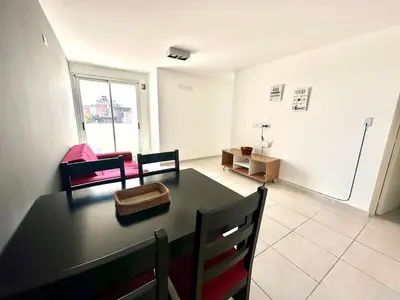 a room with a dining table and a living room at Alojamiento para 3 personas in Cordoba