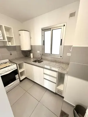 a small kitchen with a sink and a window at Alojamiento para 3 personas in Cordoba