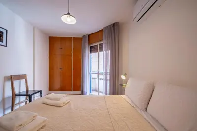 a bedroom with a bed with two towels on it at Moderno y Confortable Depto Zona Universidad - Sanatorio Allende in Cordoba