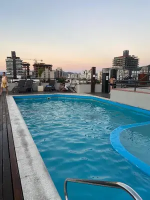 a swimming pool on the roof of a building at Sueños in Villa Carlos Paz