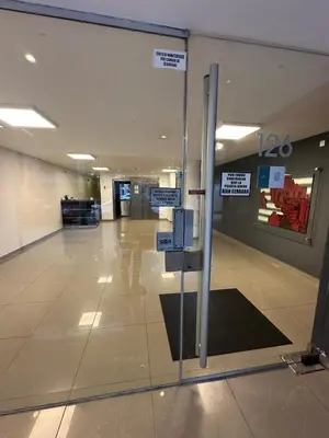 a glass door in a building with signs on it at Harmony Apart in Cordoba