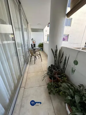 a balcony with a table and plants in a room at Harmony Apart in Cordoba