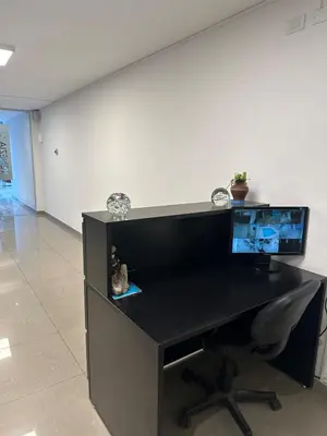 a black desk with a computer on top of it at Harmony Apart in Cordoba