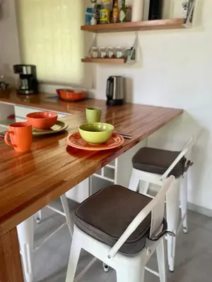 a kitchen with a wooden table with bowls on it at Caminito in Los Reartes