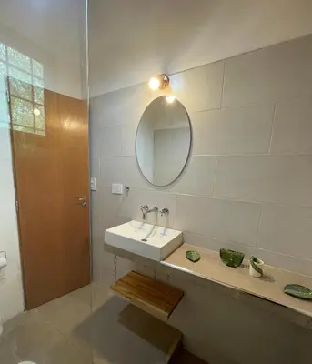 a bathroom with a sink and a mirror at Caminito in Los Reartes
