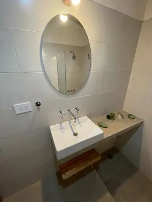 a bathroom with a sink and a mirror at Caminito in Los Reartes