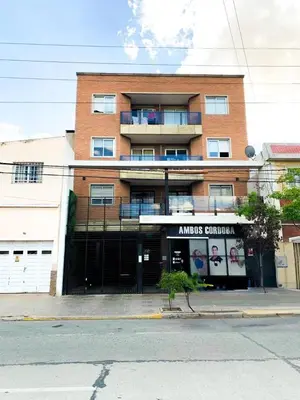 a large brick building with a sign on it at Nova Urbs in Cordoba