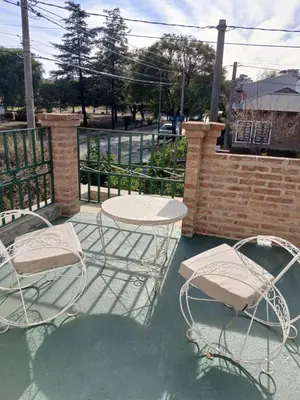 two chairs and a table and a table and chairs at Tranquilidad y descanso in Cordoba