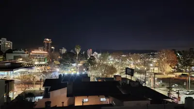 a view of a city at night with lights at Depto San Martín VCP in Villa Carlos Paz