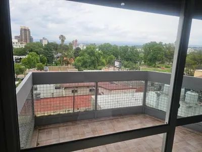 a balcony with a view of a city at Depto San Martín VCP in Villa Carlos Paz