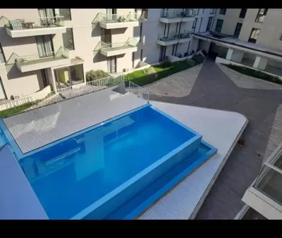 a large blue swimming pool on top of a building at Sam Gabrielll in Villa Carlos Paz