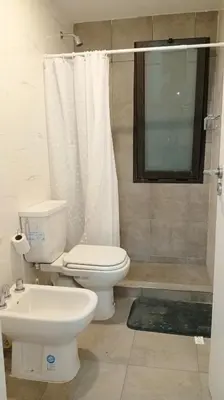 a bathroom with a toilet and a sink at Sam Gabrielll in Villa Carlos Paz