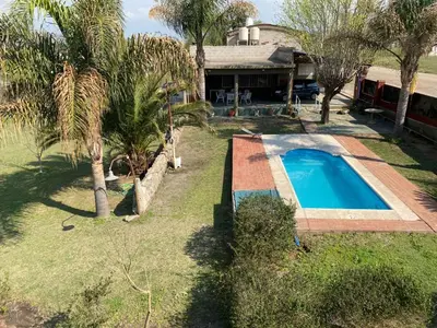 an aerial view of a house with a swimming pool at Complejo Caeiro in Bialet Massé