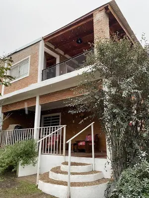 a house with stairs in front of it at Complejo Caeiro in Bialet Massé