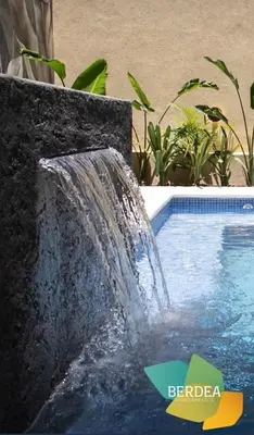 a water fountain in front of a swimming pool at Dpto NVA CBA calle OBISPO TREJO con PILETA y QUINCHO in Cordoba